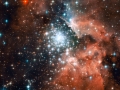 Extreme star cluster bursts into life in new Hubble image